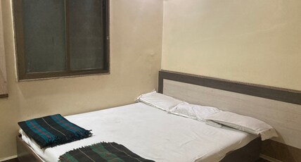 HOTEL DWARKAMAI  Room Type - Double Bed Room Non-A.C