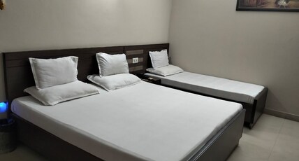 HOTEL VARSA Room Type - Triple Bed Executive AC