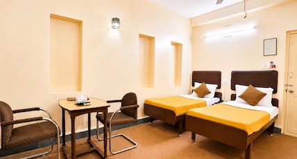 Hotel Hospice Opp. Surat Railway Station East, Khand Bazar, Varachha Road. Room Type - Deluxe Room Hotel Hospice Opp. Surat Railway Station East, Khand Bazar, Varachha Road. Room Type - Deluxe Room