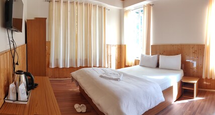 Eco Log Hut Resort Room Type - Queen Double Bedded (DELUXE)