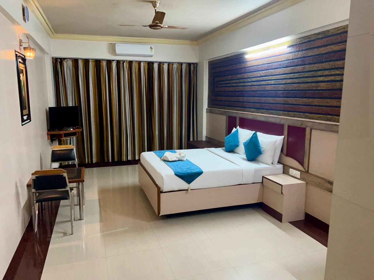 The Grand Krisha Rooms - Tap to explore photos