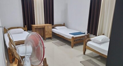 Ammu's Homestay Room Type - First Floor Bedroom with a square-shaped hall, featuring an open center and a pergola right above. Ammu's Homestay Room Type - First Floor Bedroom with a square-shaped hall, featuring an open center and a pergola right above.