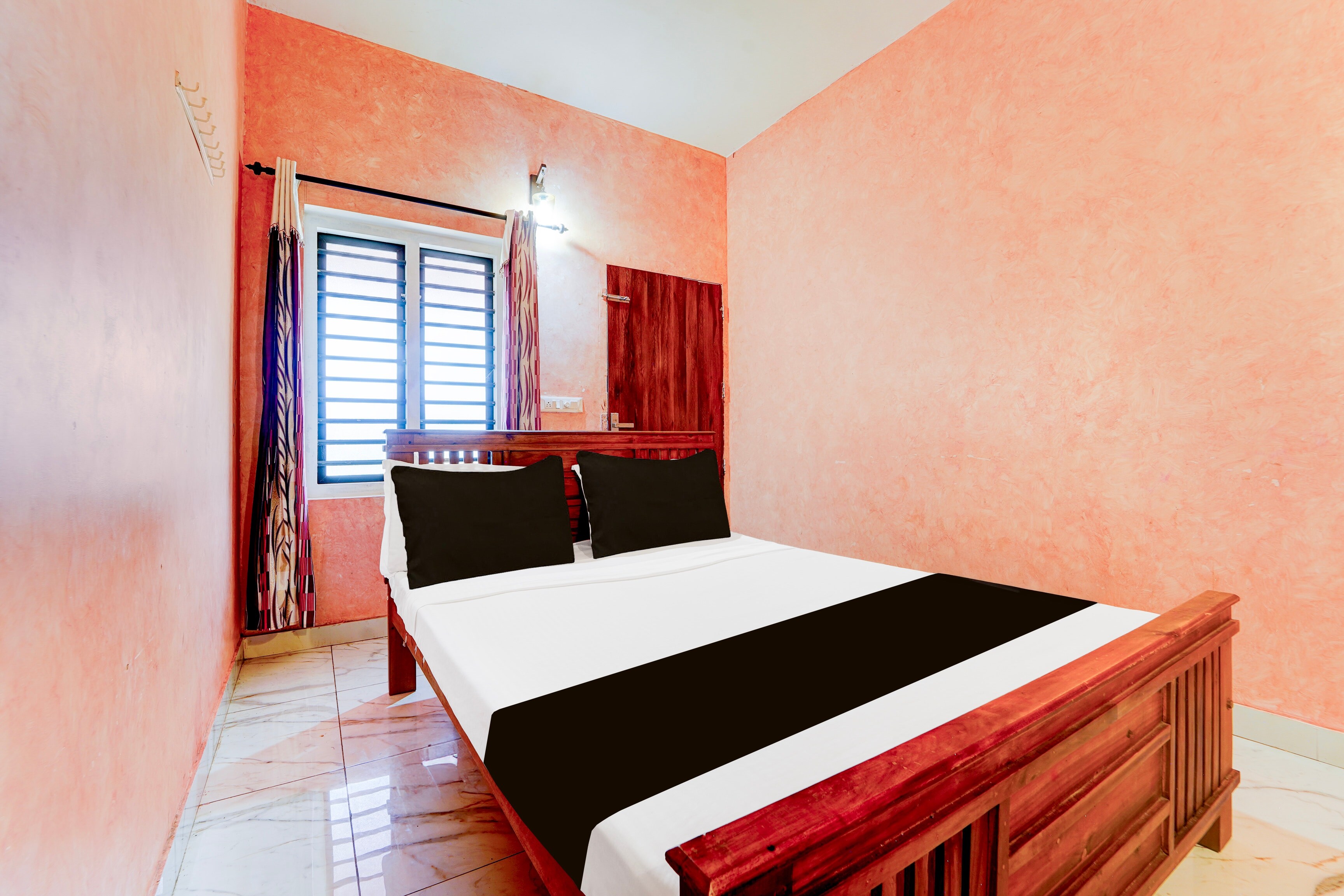 Hotel O IQ Rooms - Tap to explore photos