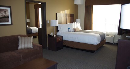 Best Western Plus Lacombe Inn & Suites Room Type - Suite-1 King 1 Queen, Non-Smoking, Separate Bedroom, Microwave And Refrigerator, Led Television, Sof Best Western Plus Lacombe Inn & Suites Room Type - Suite-1 King 1 Queen, Non-Smoking, Separate Bedroom, Microwave And Refrigerator, Led Television, Sof