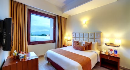 Royal Sarovar Portico Room Type - Deluxe King Bed Royal Sarovar Portico Room Type - Deluxe King Bed