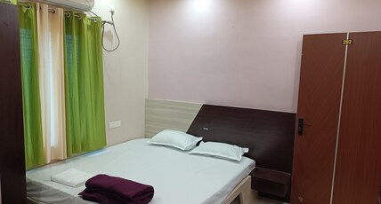 Naman Homes Near XIM University Room Type - Deluxe AC Room