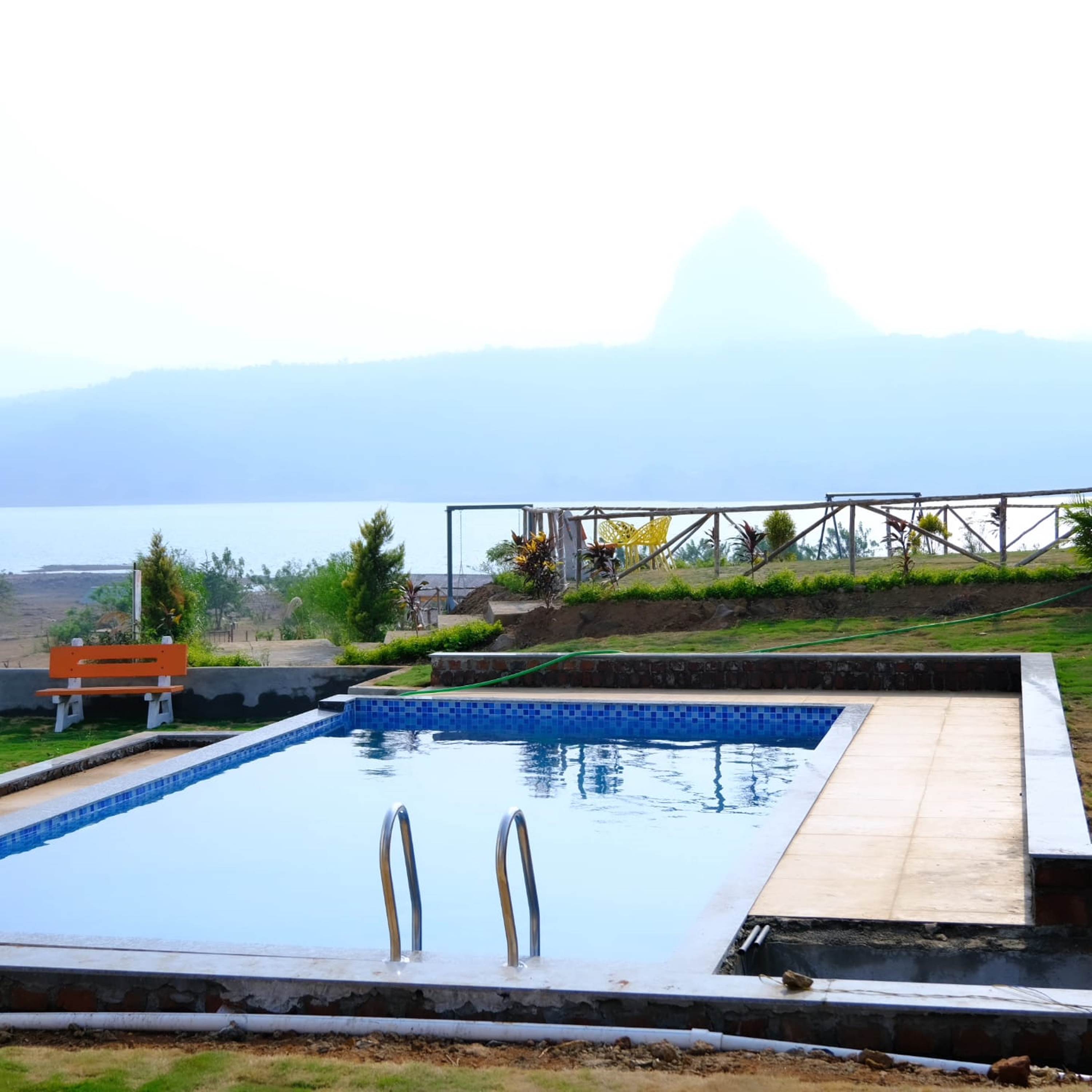 Plumeria Retreat Lakeside Cottages - Tap to explore photos