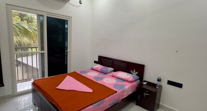 Nana's Residency, Aluva Room Type - Premium Bedroom Upstairs with balcony 1