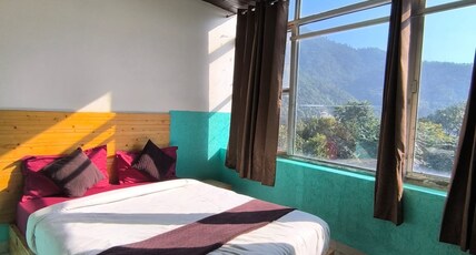 Tatsat Hostel & Caffe,   Bliss Lane , Laxman Jhula Room Type - Deluxe Room with Mountain View