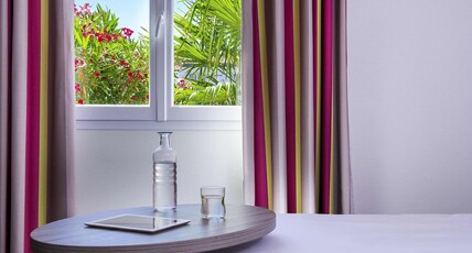 ibis Styles Saint Gilles Croix de Vie Room Type - Standard Family Suite with a double bed and a sofa bed sleeping two