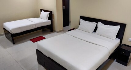 Temple Stay - Uma Residency & Guest House Room Type - Premium Triple - AC
