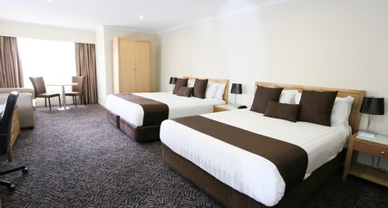 Best Western Plus Hovell Tree Inn Room Type - 1 King 1 Queen, Non-Smoking, Deluxe Room, Wireless Internet, Pillow Top Mattress, Cable Tv, 32-Inch 