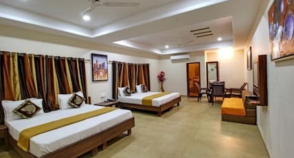 Achal Resort (Pure Veg.) Room Type - Four Bed Family Room with Sofa and Garden View Achal Resort (Pure Veg.) Room Type - Four Bed Family Room with Sofa and Garden View