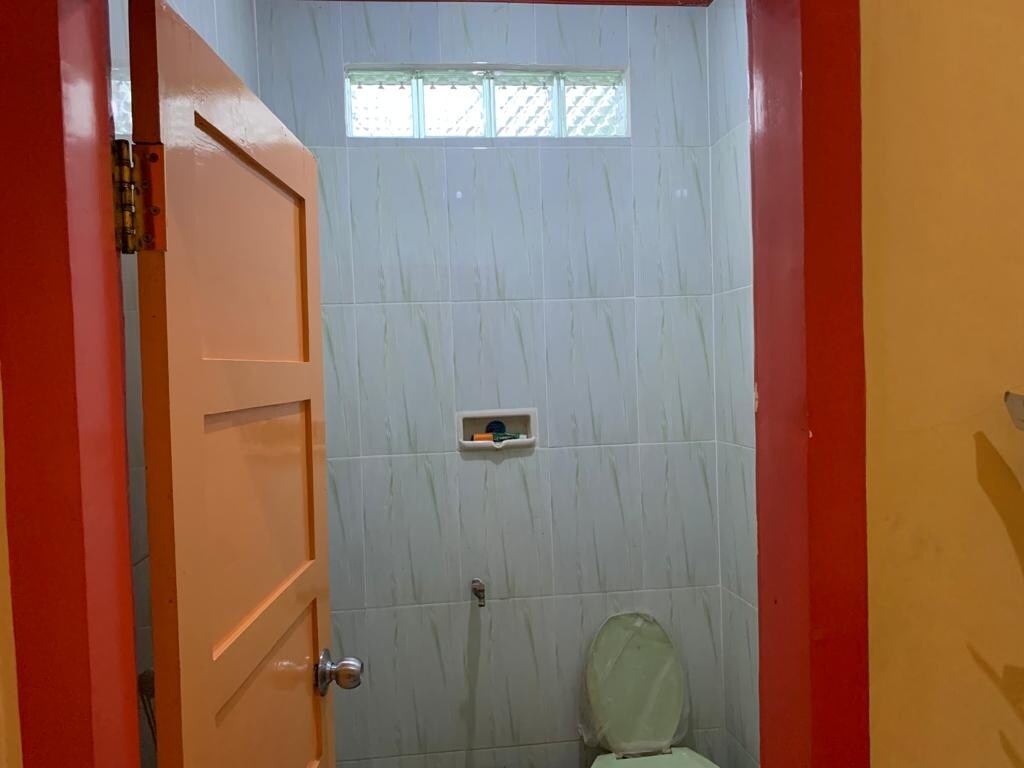 Hotel O Wisma Rima Melati - Tap to explore photos