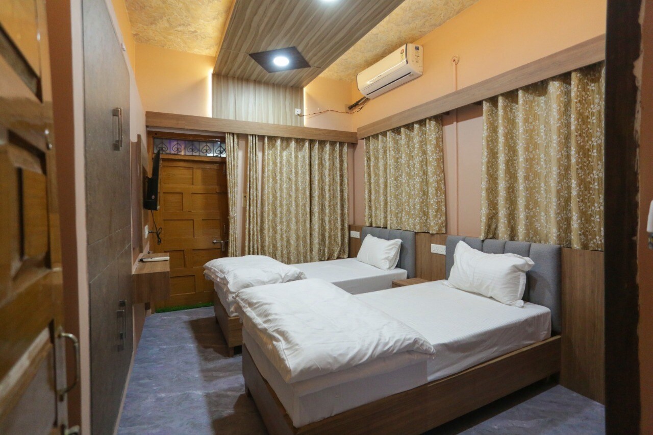 Mahadev P Guest House - Tap to explore photos