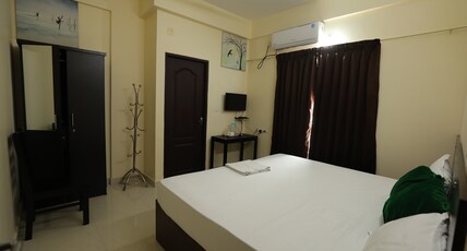 Classique Inn | Near Padmanabhaswamy Temple Room Type - Deluxe AC Room