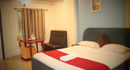 PAVAN MANSION Room Type - Deluxe AC Room