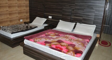 Pushpa Residency Room Type - Deluxe Triple Bed Room