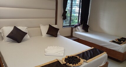 M JAC INTERNATIONAL Room Type - AC Deluxe Room Triple Bed With Balcony