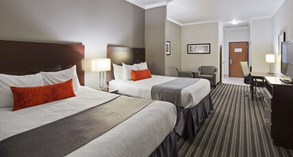Best Western Plus Austin Airport Inn and Suites Room Type - Accessible - Suite 2 Queen, Mobility Accessible, Roll In Shower, Sofabed, Microwave And Refrigerator Best Western Plus Austin Airport Inn and Suites Room Type - Accessible - Suite 2 Queen, Mobility Accessible, Roll In Shower, Sofabed, Microwave And Refrigerator
