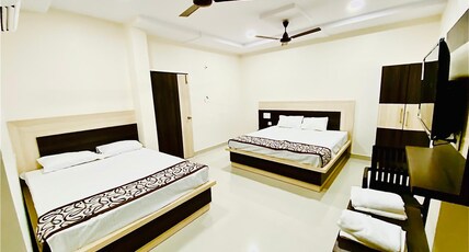 SRI BHAVYA RESIDENCY Room Type - Deluxe Family Suite Room AC
