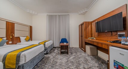 Alfakhamah Aldahabi Hotel Alshuhada Room Type - Twin room Alfakhamah Aldahabi Hotel Alshuhada Room Type - Twin room