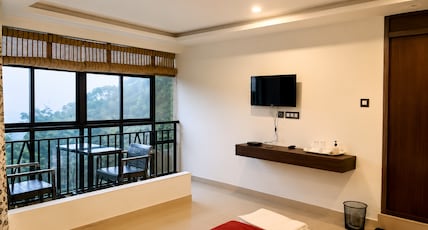 Grand Munnar Rooms Room Type - Luxury room non ac with waterfall view Grand Munnar Rooms Room Type - Luxury room non ac with waterfall view