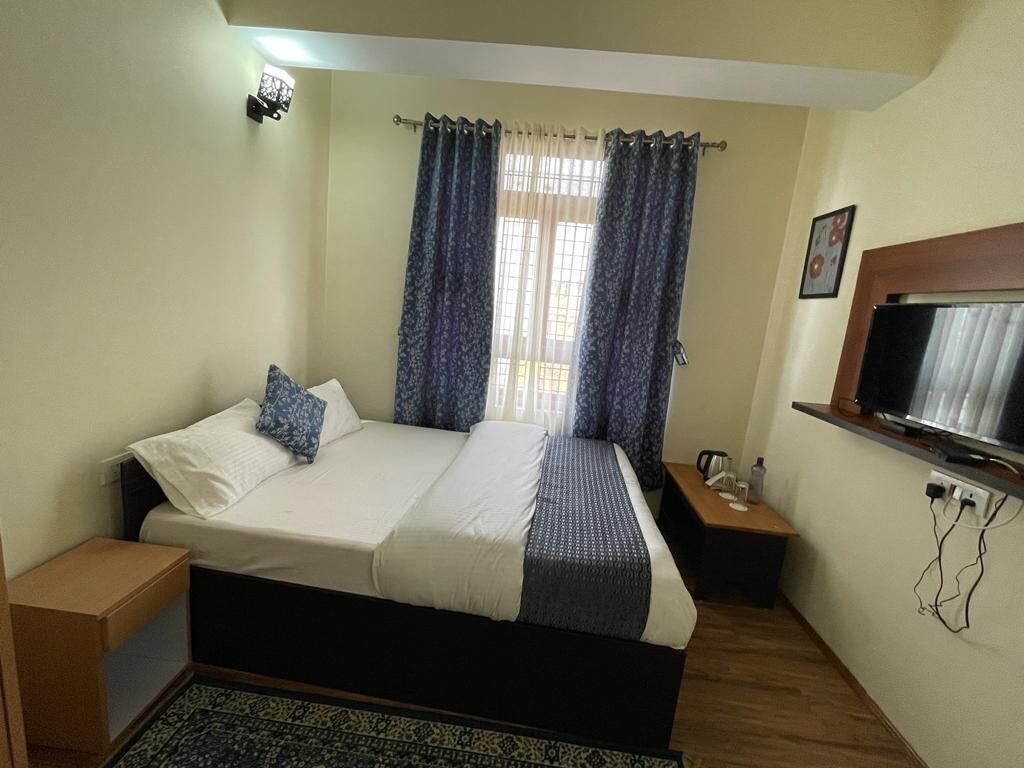 Hotel O Home Urvi Griham - Tap to explore photos