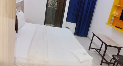 Staylo Pink Residency Room Type - Deluxe King Room