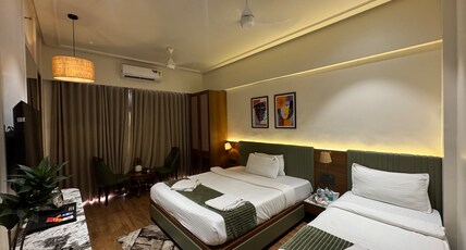 Shlok Inn Room Type - 3 Bedded Family AC Room