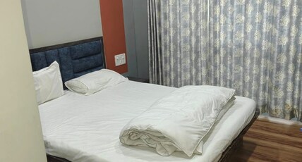 Shiva Family Lodging Room Type - Deluxe Room with City View King Bed