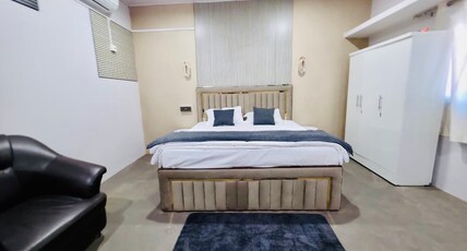 AXOM HOMESTAY & VILLAS Room Type - Super Deluxe Room with Air Conditioning