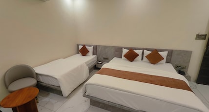 Hotel Morvi Nandan Room Type - Deluxe Triple Room ( 1 Double Bed + 1 Single Bed | 3 Pax ) Hotel Morvi Nandan Room Type - Deluxe Triple Room ( 1 Double Bed + 1 Single Bed | 3 Pax )
