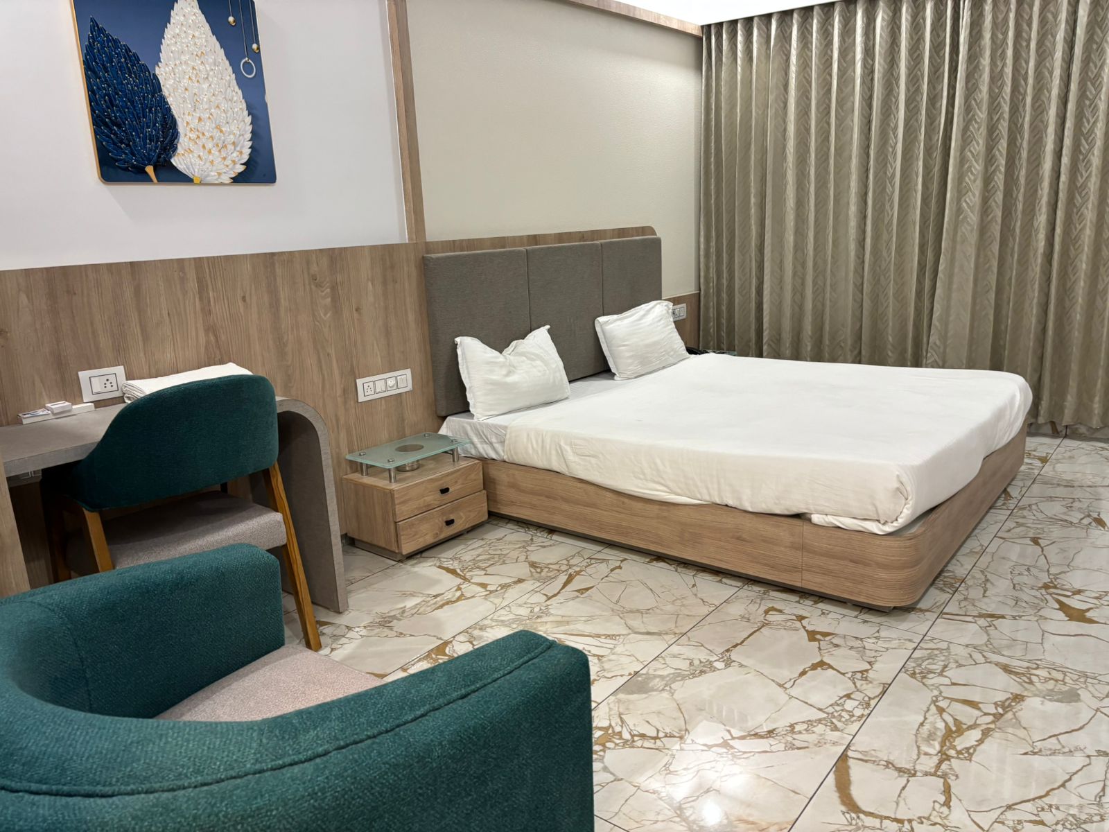 Hotel Saffron, Chikhli - Tap to explore photos