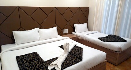 GRAND KODAI SR INN Room Type - Deluxe Triple