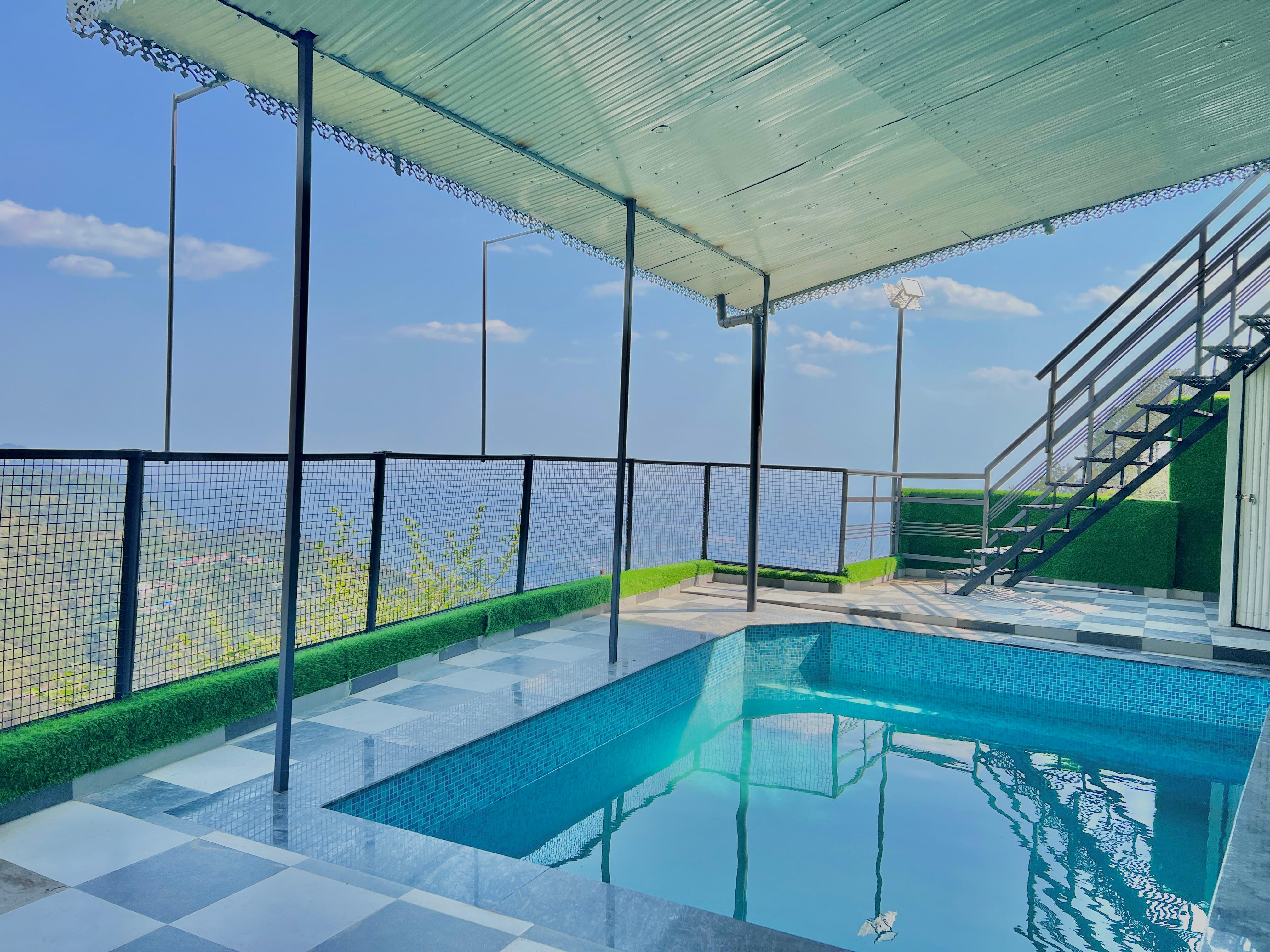 Hill Top Heaven By Elvora Hotels & Resorts - Tap to explore photos