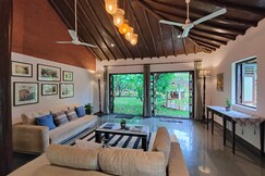 SaffronStays Mango Huts by the river