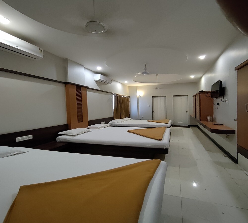 Hotel Adarsh Deluxe - Tap to explore photos