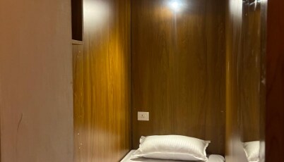 Cozy Rooms & Dormitory near KSRTC Stand Room Type - AC Pod Rooms
