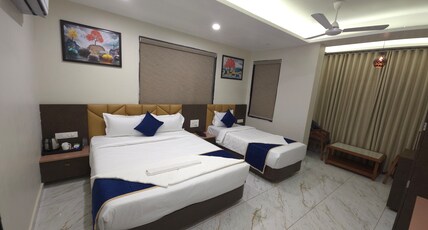 Hotel Aaradhya Inn Room Type - 3 Bedded AC Super Deluxe Room (Price is for 3 Adults)