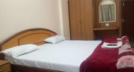 HOTEL AADDITAYAA INTERNATIONAL Room Type - Deluxe Room(Stags Not Allowed)