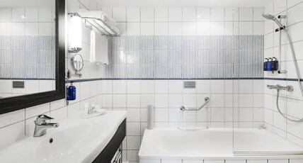 Mercure Klaipeda City Room Type - Junior Suite with a kingsize bed and a sofa