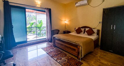 Shirke's Holiday Home Room Type - Deluxe Room