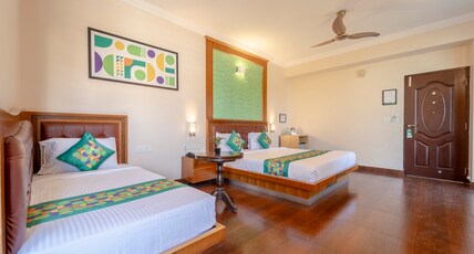 Treebo Akshaya Palace Inn Room Type - Premium Room with Mini Fridge