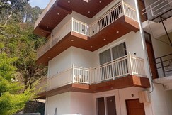 The Green Feather 2BHK Apartment with a kitchen
