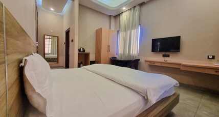 Anandam Homestay Room Type - Room with King Size Bed and Smart TV