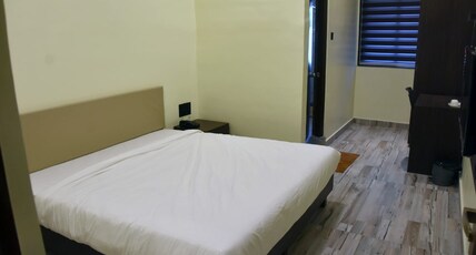 Hotel Radhe Inn Room Type - AC Delux Room