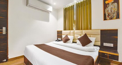 The Crims Hotel Pratap Nagar Room Type - Deluxe Room