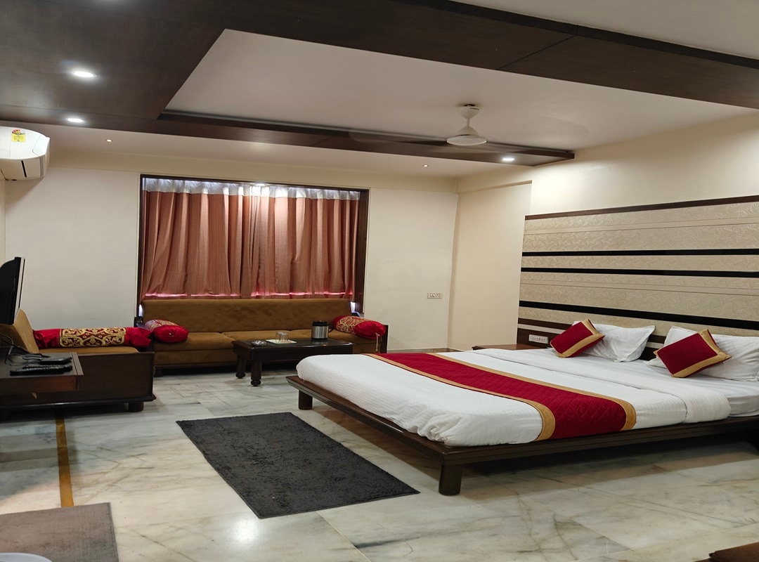 Hotel Ambaji International - Tap to explore photos