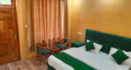 Harsil woodstone homestay Room Type - Deluxe room.